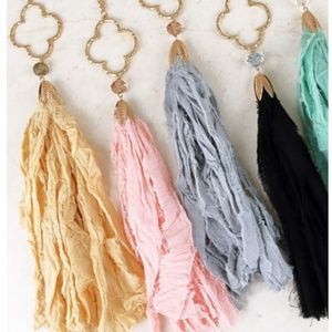 Long gold tone chain with fabric fringe